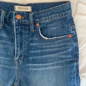 Flared darker blue jeans